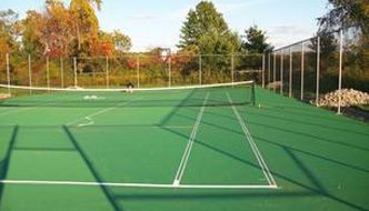 A tennis court with two players on it